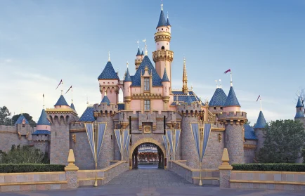 Sleeping Beauty Castle at Disneyland stands under blue skies, its entrance empty—a serene backdrop perfect for envisioning your next Engineering Summit or to reimagine engineering in an inspiring setting.