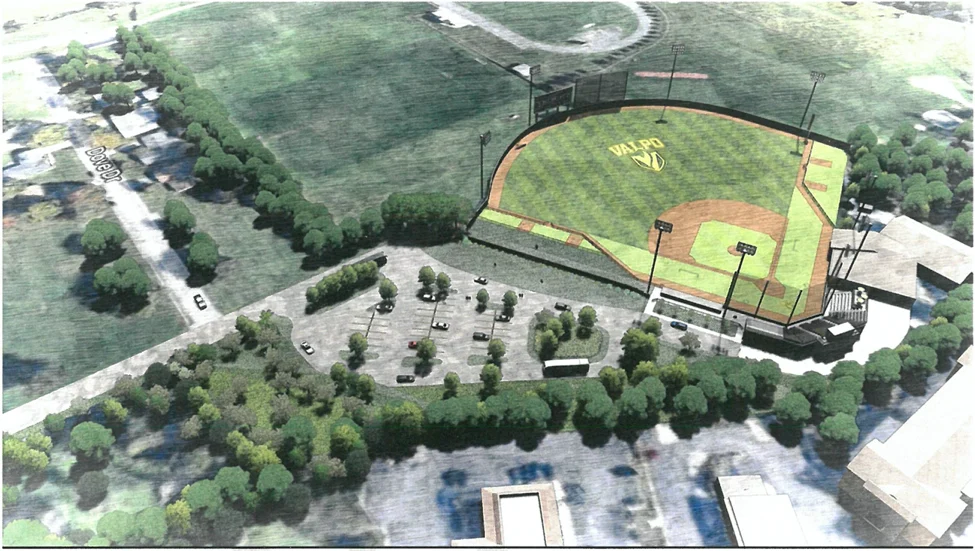 Aerial view of Bauer Field labeled "VALPO," showcasing recent renovation work, surrounded by parking lots and trees.