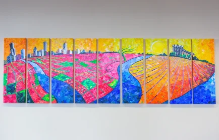 Colorful mural of a cityscape and farmland divided by a river under a bright yellow sky, painted on eight panels—an inspiring scene perfect for sparking college advice or sharing freshman year tips.