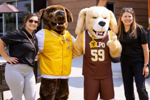 Dr. Zromkoski and Dr. Carroll smile with Beacon & Blaze