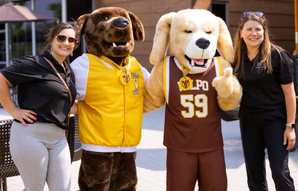 Dr. Zromkoski and Dr. Carroll smile with Beacon & Blaze