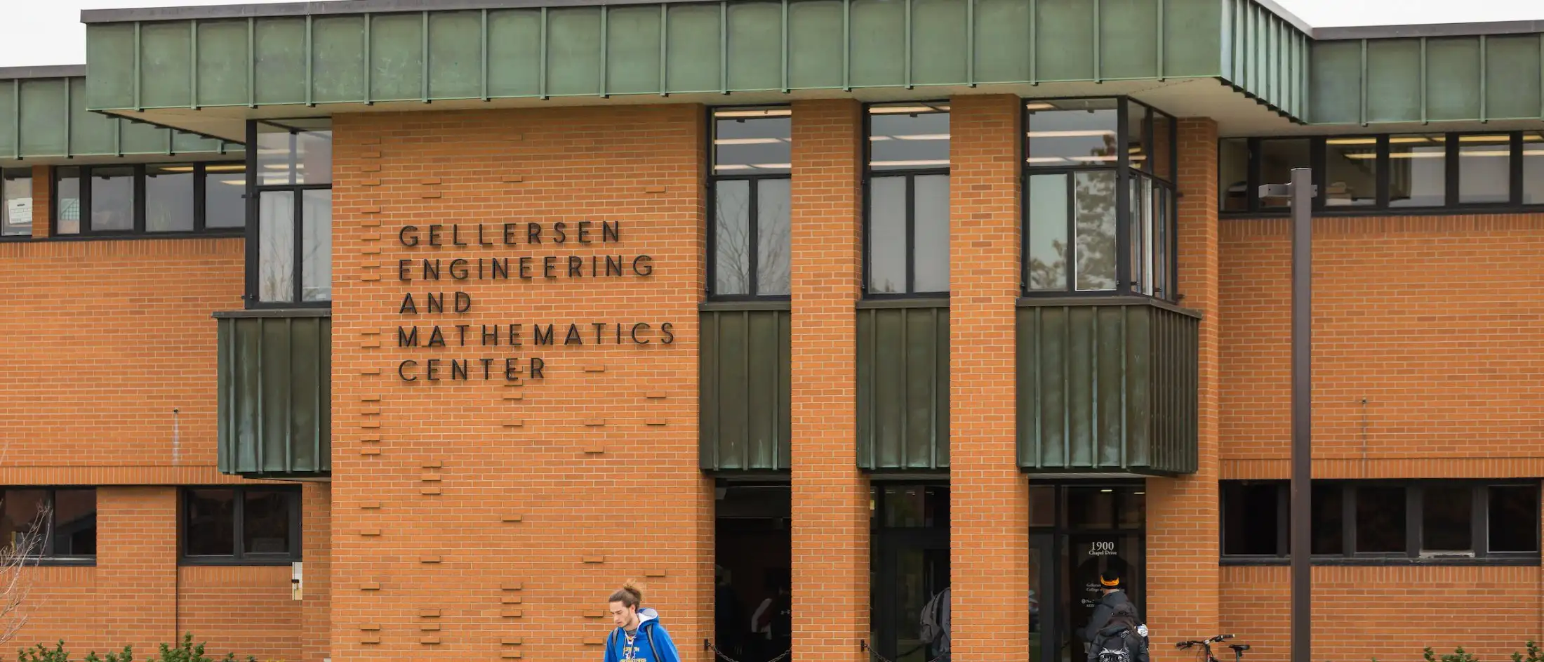 The Gellersen Engineering, Mathematics, and Computer Science Center building with people walking outside.