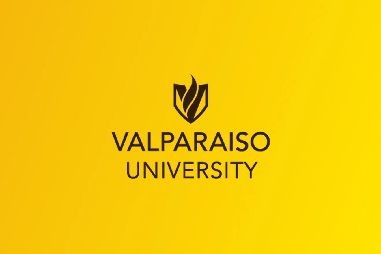 Valparaiso University logo with a flame symbol on a bright yellow background, representing excellence in fields like Business Analytics.