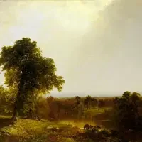 A large tree stands in a sunlit, green landscape under a bright, hazy sky, reminiscent of scenes featured in nature exhibitions & series.