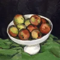 A white bowl filled with red and green apples sits on a green cloth against a dark background, capturing the timeless appeal often featured in still life exhibitions & series.