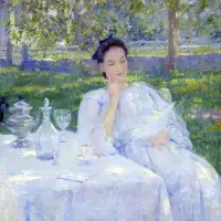 A woman in a white dress sits at a table outdoors, reading in a sunlit garden with glassware nearby—a serene moment reminiscent of scenes from Exhibitions & Series.