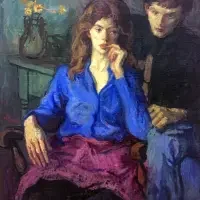 A woman in a blue blouse sits pensively while a man stands behind her in a dimly lit room, evoking the quiet intensity often explored in exhibitions & series.