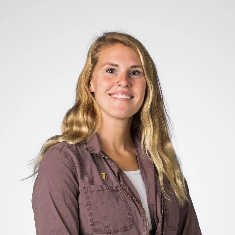 Smiling woman with long blonde hair, MSN, RN Rachael Payne, wearing a mauve jacket over a white top, against a plain background.