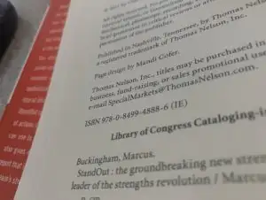 Close-up of a book page showing publishing details, ISBN, How To Instructions, and part of the Library of Congress Cataloging.