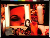 A hand holds a cutout photo of a woman's face over a cluttered vanity with makeup and a large mirror, exploring themes of American Art and National Identity.