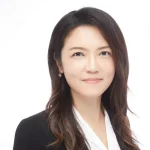 Professional woman with long brown hair, PhD holder Yi-Ju Chien, wearing a black blazer and white blouse, smiling at the camera.