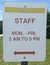 Sign reads: "STAFF PARKING MON. - FRI. 2 AM TO 5 PM" with a double-headed arrow below.